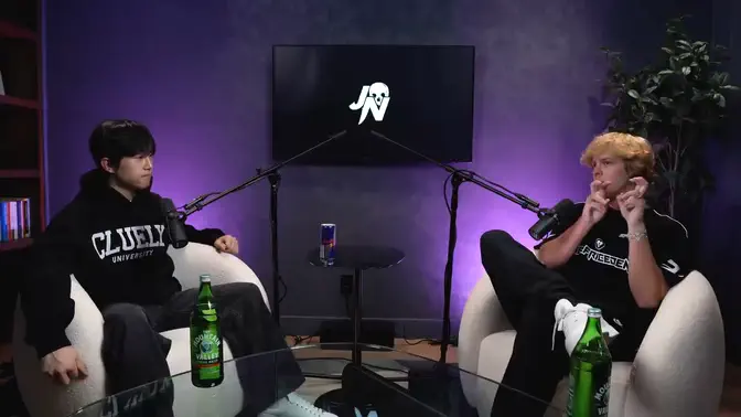 A long podcast video: Roy Lee and Jack Neel in a purple-lit studio