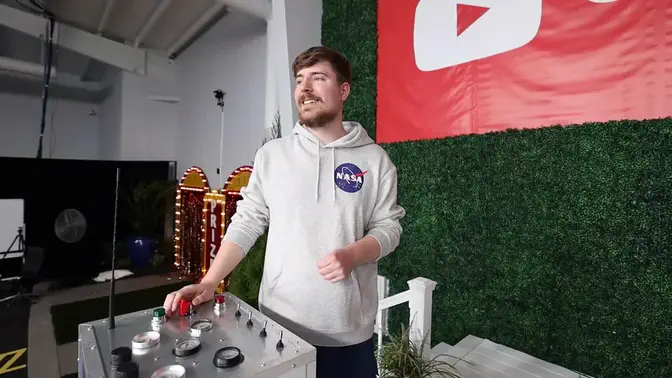 A long video: MrBeast on his set, a hand on a control panel